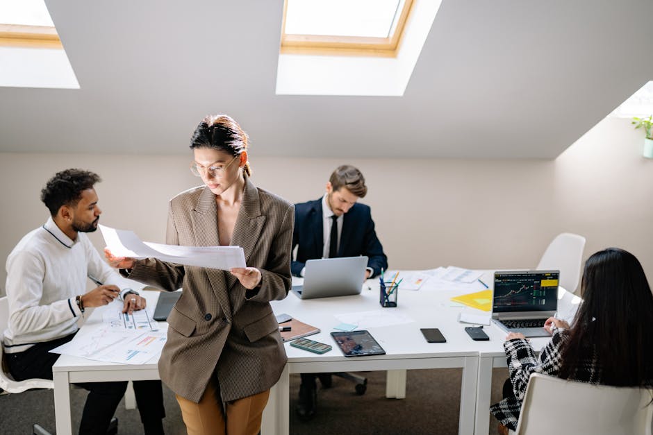 Team of colleagues working in a modern bright office space